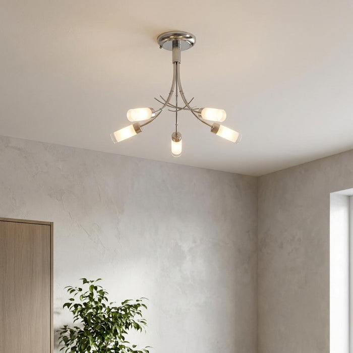 Oslo 5-light antique chrome semi-flush ceiling fixture with frosted glass shades in a neutral room setting.