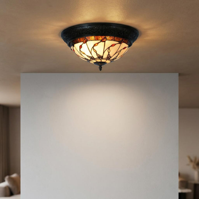 Papillon flush Tiffany ceiling light with a butterfly-patterned stained glass shade and ornate dark metal base.