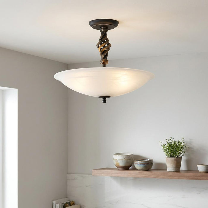 Pembroke 3 light semi-flush ceiling fixture with a twisted black and gold stem and a frosted glass bowl shade.
