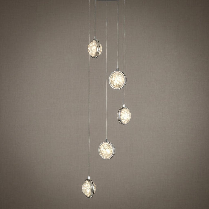 Quartz 5-light multi-drop pendant with chrome-rimmed bubble glass shades staggered at varying heights.