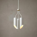 Modern three-light chandelier with white cylindrical shades and aged brass accents against a grey wall.