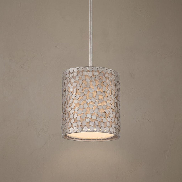 Cylindrical mini pendant light with an old silver metal confetti mosaic shade and warm interior illumination.
