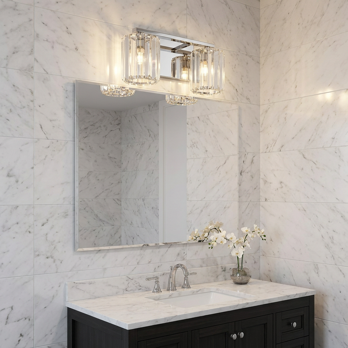 Two-light chrome bathroom wall light with crystal shades mounted above a mirror on white marble tiled walls.