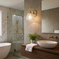 A brass wall sconce with a ribbed glass shade mounted above a wooden vanity in a modern bathroom.