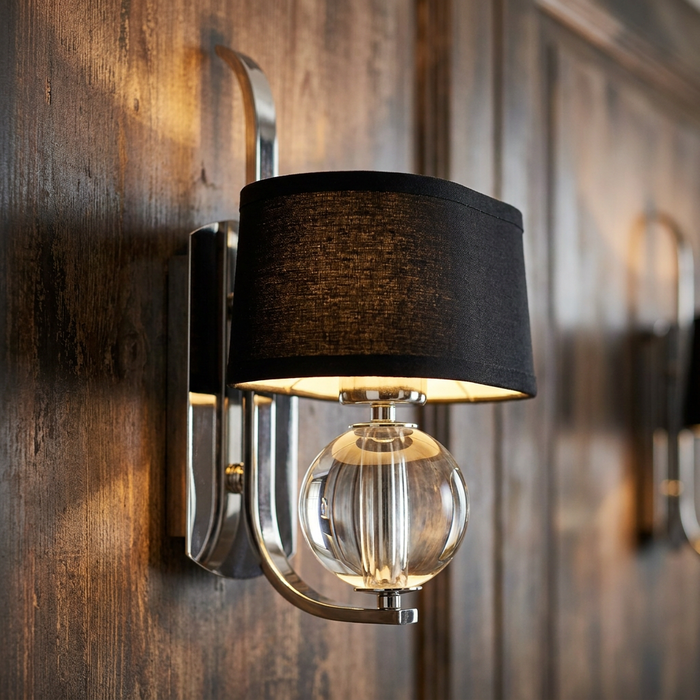 Quoizel Gotham wall light with a black fabric shade and clear glass globe on a polished silver frame.