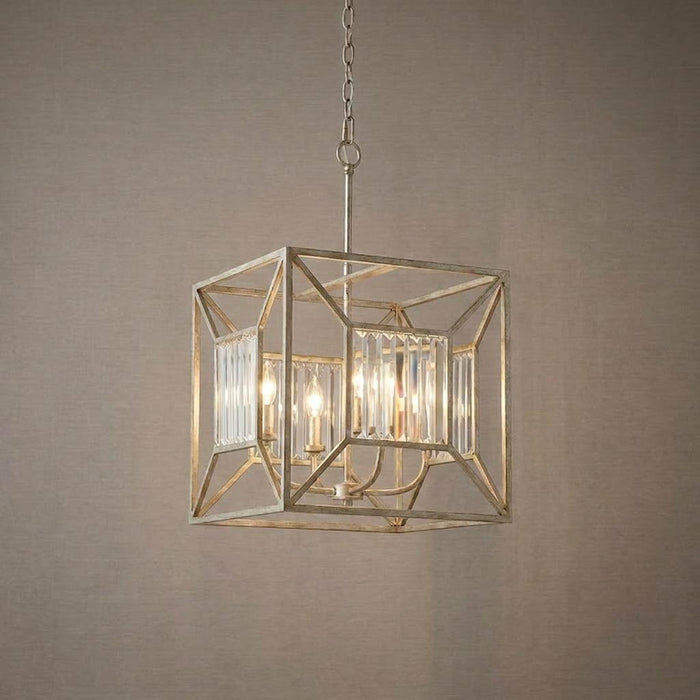 Four-light gold ceiling pendant with a geometric cube frame and vertical crystal rods against a neutral wall.
