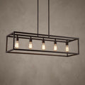 Five glowing Edison bulbs within a rectangular linear bronze cage pendant light against a neutral wall.