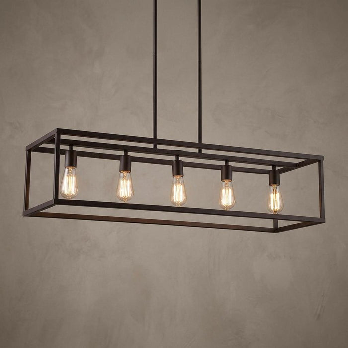 Five glowing Edison bulbs within a rectangular linear bronze cage pendant light against a neutral wall.