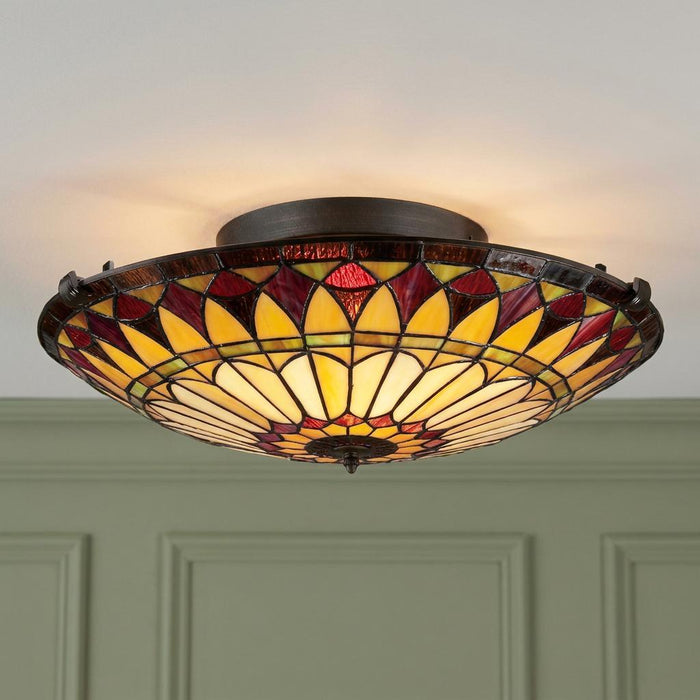 Tiffany-style flush mount ceiling light with yellow and red geometric stained glass shade.