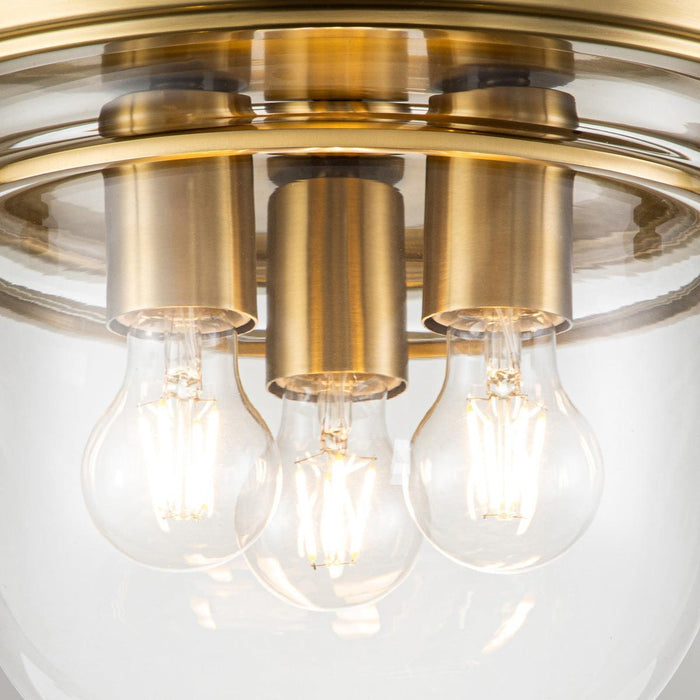 Quoizel Whistling 3 Light Brass Bathroom Ceiling Flush Close Up Image
