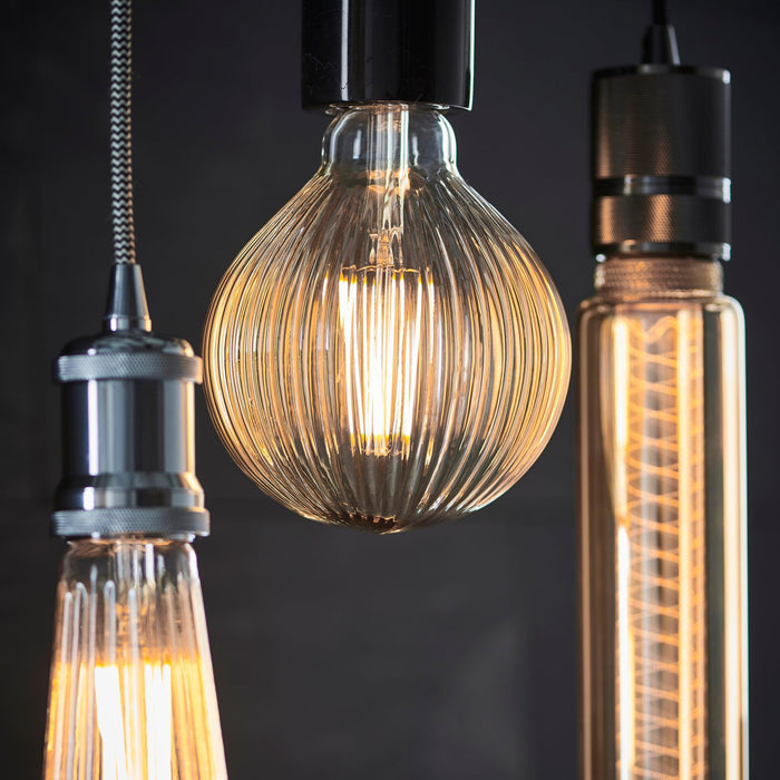 ribb e27 amber tinted ribbed decorative 4w led light bulb Close Up Lit Image