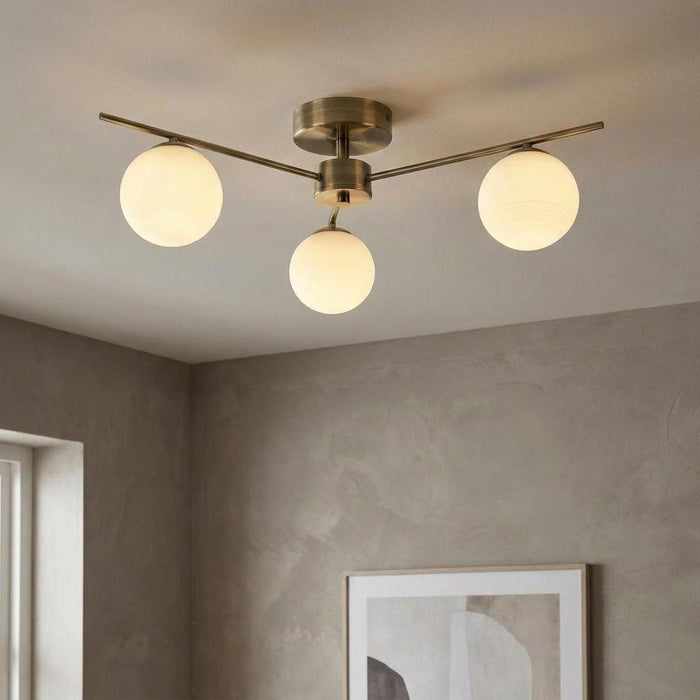 Ruse 3 Light Antique Brass Semi-flush Ceiling Light by Oaks Lighting — suits living rooms, dining rooms & hallways