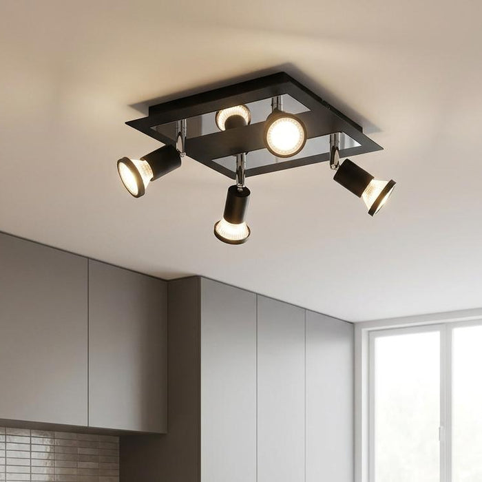 Eglo Sarria black and chrome 4-light plate spotlight mounted on a modern kitchen ceiling.