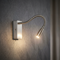 Brushed chrome LED wall light with a flexible gooseneck arm mounted on a grey textured wall.