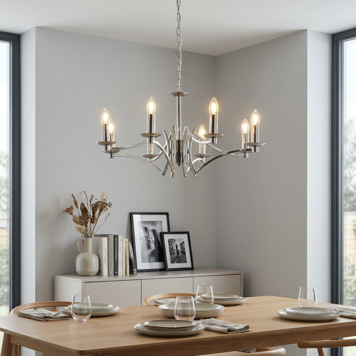 Searchlight Ascot 8 Light Chrome Chandelier hanging over a modern wooden dining table in a bright room.