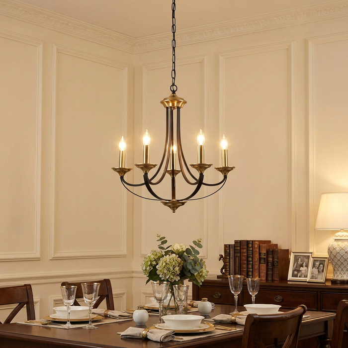 Searchlight Belfry 5-light bronze chandelier hanging above an elegantly set dining table.