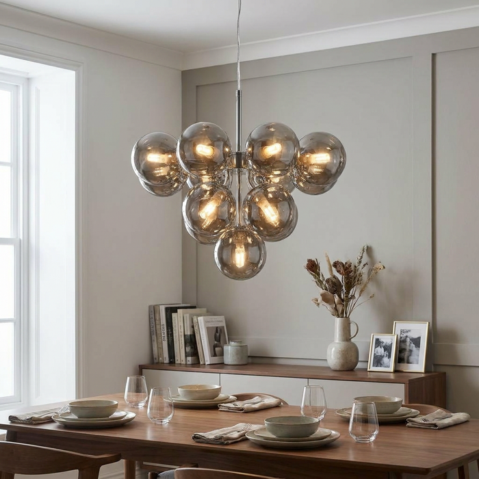Searchlight Berry 13-light chrome chandelier with smoked glass globes hanging over a modern dining table.