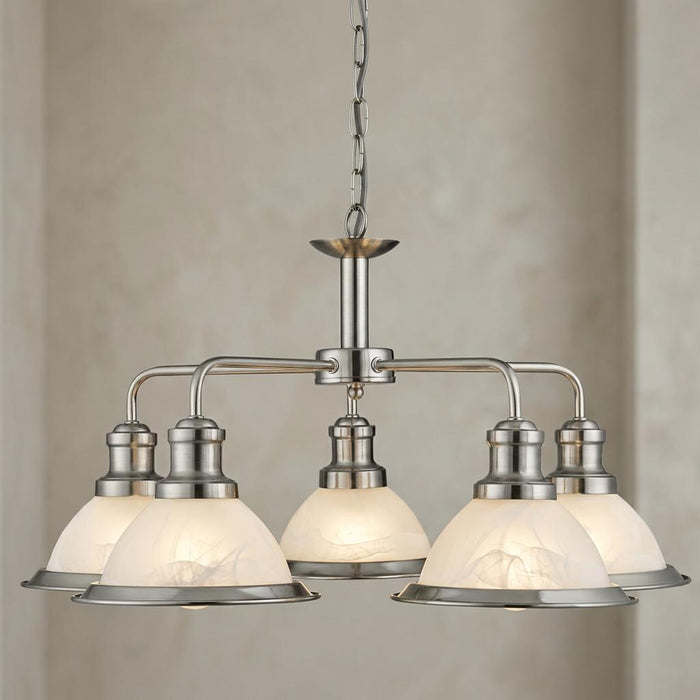 Searchlight Bistro 5-light satin silver ceiling pendant with marble glass shades hanging in front of a neutral wall.