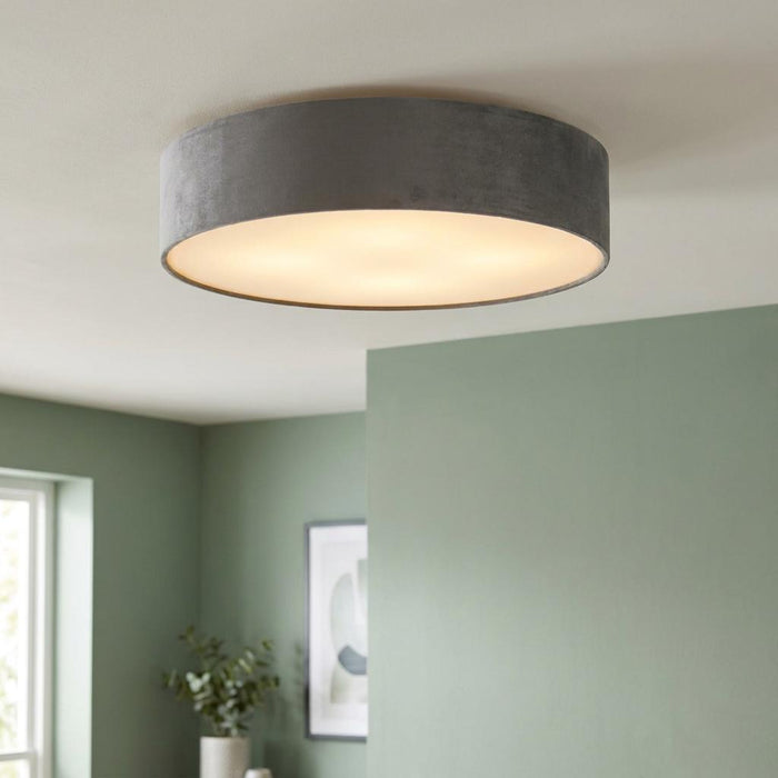 Searchlight Drum 3-light ceiling flush fixture with a grey velvet shade and frosted diffuser in a modern room.