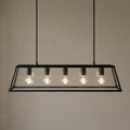 Searchlight Voyager five-light black and glass lantern bar pendant against a neutral wall.