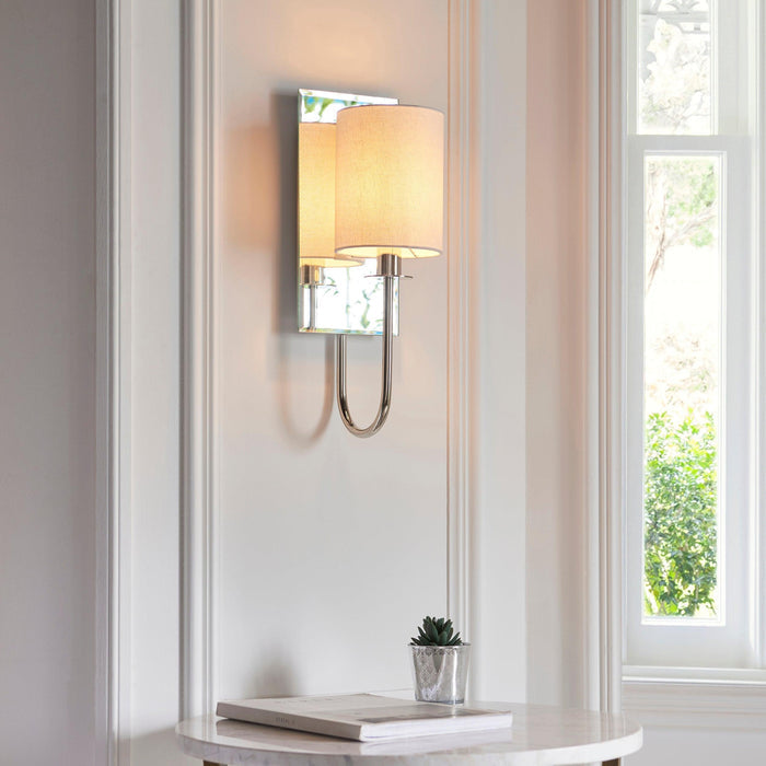 sheena nickel wall light with mirrored glass back