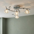 Sierra 4-light chrome semi-flush ceiling fixture with faceted glass shades and decorative metal leaf accents.