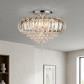 Modern chrome and acrylic flush ceiling light with cascading crystal beads, mounted in a minimalist interior.