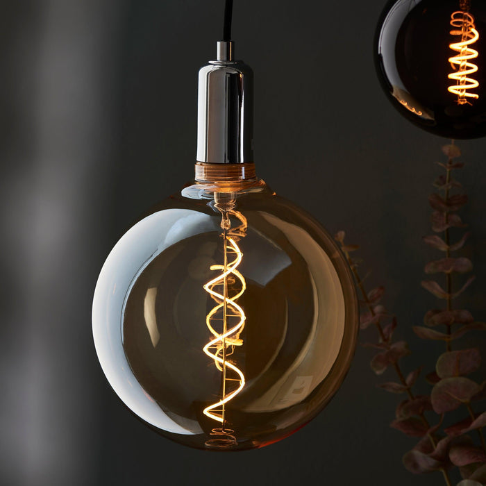 spiral large amber tinted globe filament 4w led light bulb Living room close up image