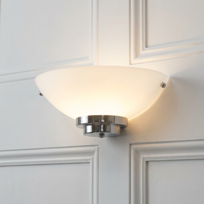 Stratton Art Deco chrome wall light with a frosted glass half-bowl shade on a white paneled wall.
