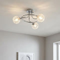 Modern Tabia 3-light chrome flush ceiling light with glowing textured glass globes on a white ceiling.