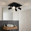 Eglo Tamara 1 black and chrome 4-light plate spotlight mounted on a bathroom ceiling above a vanity and mirror.