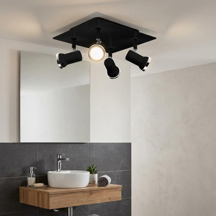 Eglo Tamara 1 black and chrome 4-light plate spotlight mounted on a bathroom ceiling above a vanity and mirror.