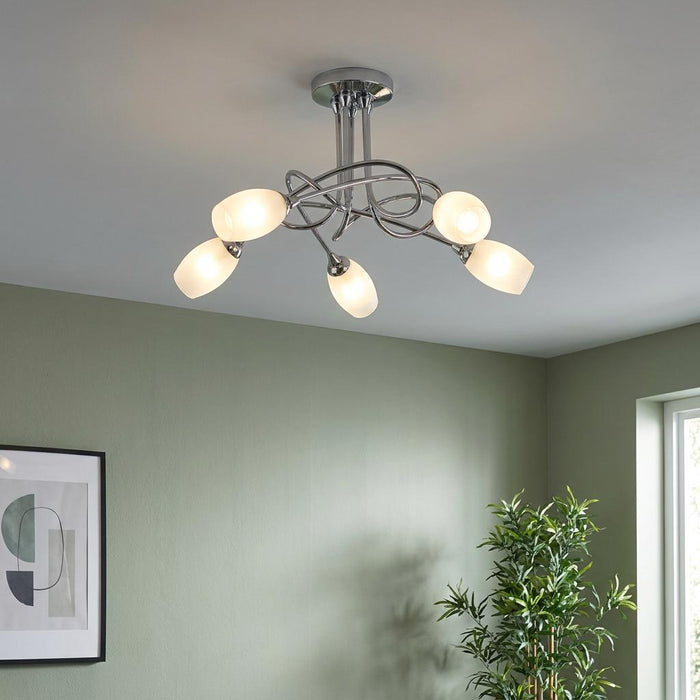 Tara 5 Light Chrome Semi-flush Ceiling Light with frosted glass shades in a green room.