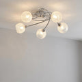 Tarn 5-light chrome flush ceiling light with crackled glass globe shades mounted on a white ceiling.