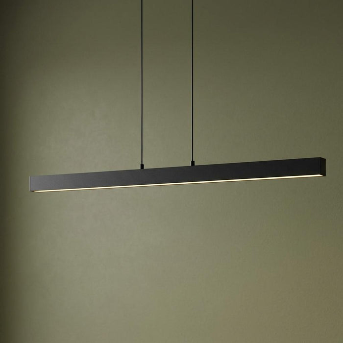 Minimalist black linear LED pendant light suspended against a muted olive green wall.