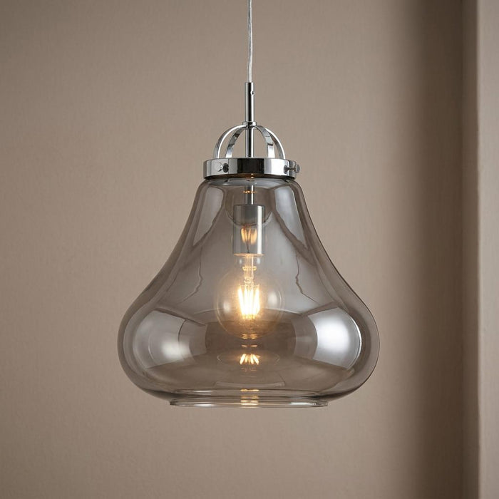 Turua Chrome Ceiling Lantern featuring a smoked glass bell shade and a visible glowing filament bulb.