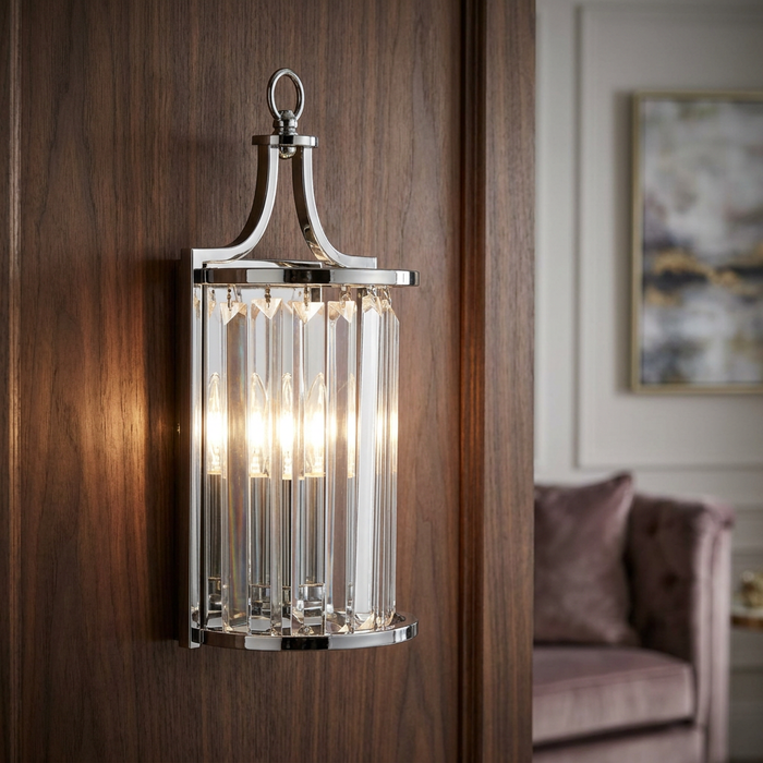 Victoria chrome wall light with crystal glass prisms mounted on a dark wood-paneled wall.