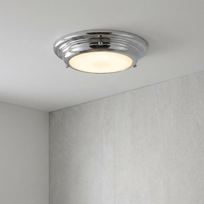 A Welland Mini LED flush ceiling light with a polished chrome trim and opal diffuser mounted on a white ceiling.